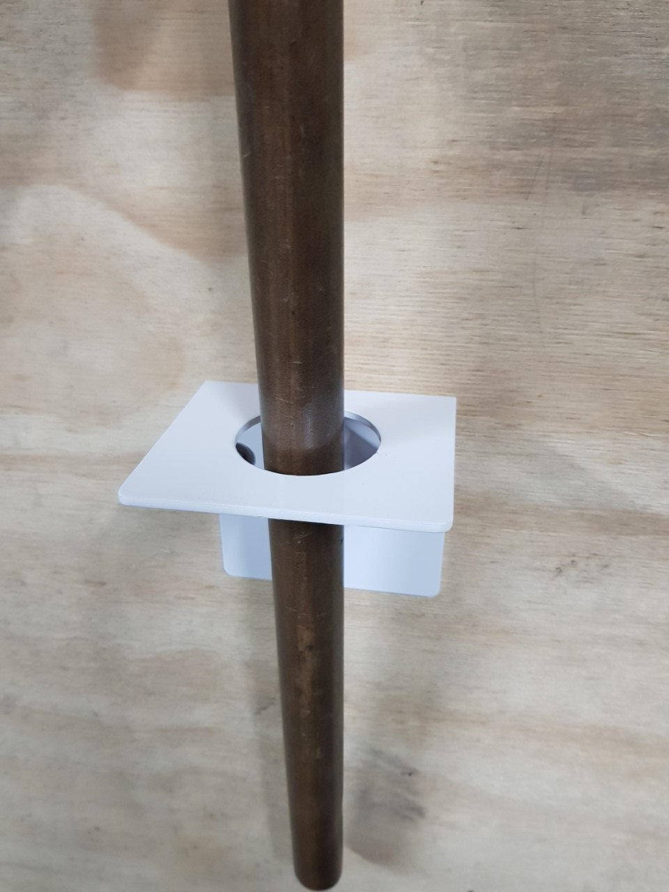 a metal pole with a hole in the middle of it